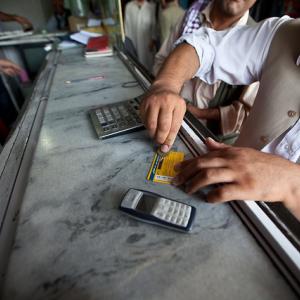 Photo: cell phone and banking cards. Institute for Money, Technology and Financial Inclusion. 