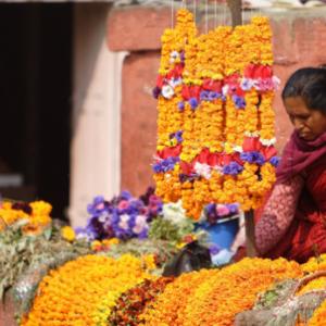 A woman sells flowers in Kathmandu, Nepal. 