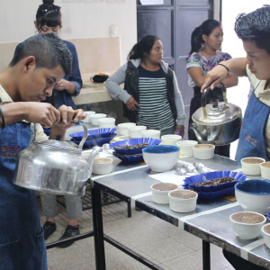 Photo of two youth pouring coffee