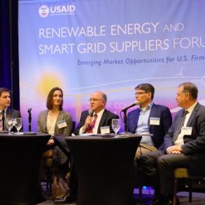 Photo description: Panelists speak at the renewable energy and smart grid suppliers forum. Credit: Cory Ragsdale / Training Resources Group