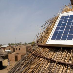 Photo description: A solar panel on the roof of a home in Kenya. 