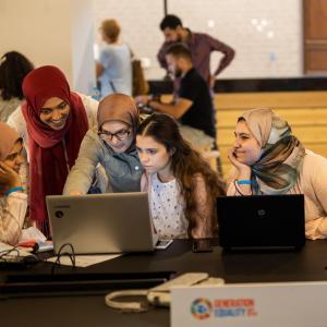Photo description: UN Women volunteers edit and translate articles on Arabic Wikipedia in Egypt. Credit: Emad Karim/UN Women.